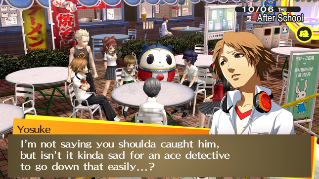 An in game screenshot from Persona 4 Golden. Kanji, Rise, Chie, Teddie, Naoto, Yukiko, Yu, and Yosuke are all sitting around an empty table in a super market cafeteria. Yosuke's character sprite is to the right of the screen, he is currently speaking and looks disappointed. The textbox at the bottom of the screen reads: 'I'm not saying you shoulda caught him, but isn't it kinda sad for an ace detective to go down that easily...?'.